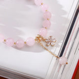 Flyshadow Stylish Natural Pink Crystal Bracelet with 8mm Beads Unique Jewelry with Starlight Plum Blossom and Flower Design Pendant